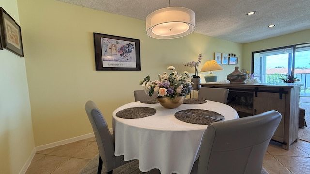 4090 Tivoli Ct Unit 303, Lake Worth, FL 33467 - dining area featuring a textured ceiling, light tile patterned floors, and recessed lighting