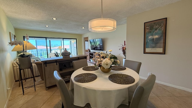 4090 Tivoli Ct Unit 303, Lake Worth, FL 33467 - dining area with a textured ceiling, light tile patterned floors, and recessed lighting