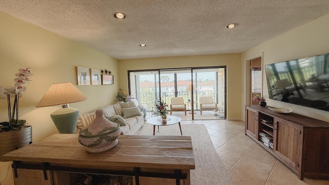 4090 Tivoli Ct Unit 303, Lake Worth, FL 33467 - living area featuring light tile patterned floors, recessed lighting, and a textured ceiling