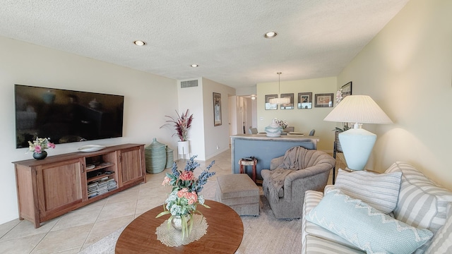 4090 Tivoli Ct Unit 303, Lake Worth, FL 33467 - living room featuring light tile patterned floors, recessed lighting, and a textured ceiling