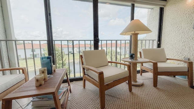 4090 Tivoli Ct Unit 303, Lake Worth, FL 33467 - sunroom / solarium with healthy amount of natural light, a textured wall, and carpet flooring