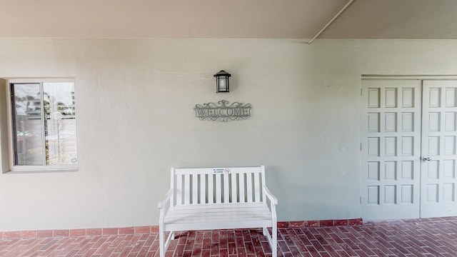 4090 Tivoli Ct Unit 303, Lake Worth, FL 33467 - property entrance with a porch and stucco siding