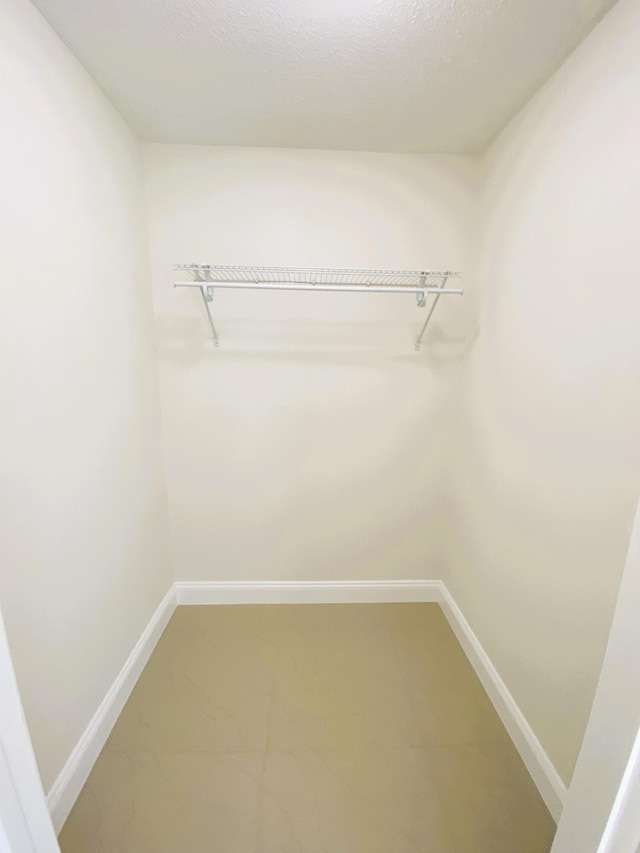 815 W Boynton Beach Blvd Unit 7-102, Boynton Beach, FL 33426 - walk in closet with light marble finish flooring