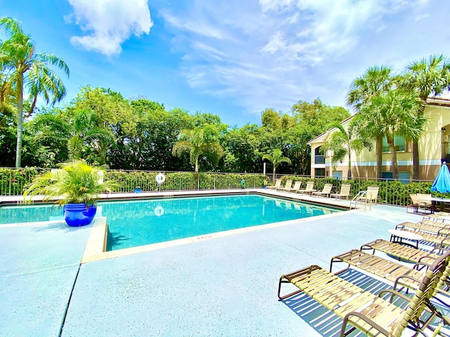815 W Boynton Beach Blvd Unit 7-102, Boynton Beach, FL 33426 - community pool featuring a patio area and view of wooded area