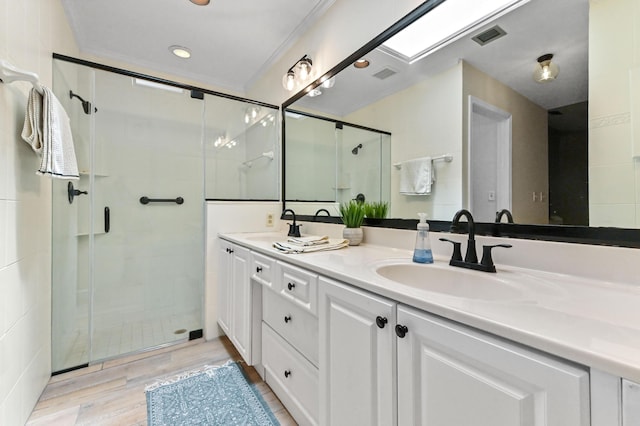 5210 NW 53rd Ave, Coconut Creek, FL 33073 - full bath featuring double vanity, a stall shower, wood finished floors, and recessed lighting