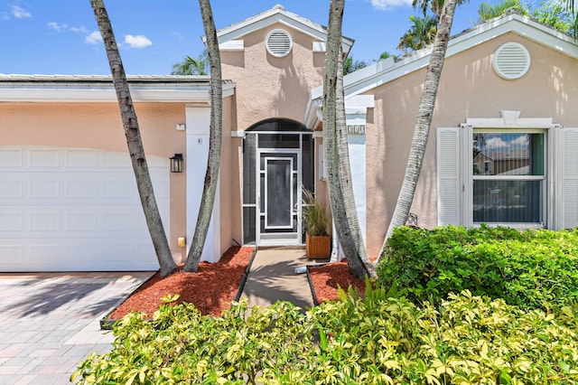 5210 NW 53rd Ave, Coconut Creek, FL 33073 - property entrance featuring stucco siding and driveway