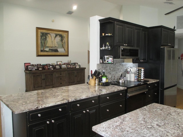 6314 Water Lilly Ln, Boynton Beach, FL 33437 - kitchen with appliances with stainless steel finishes, dark cabinets, open shelves, decorative backsplash, and light stone counters