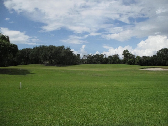 6314 Water Lilly Ln, Boynton Beach, FL 33437 - view of community with golf course view, view of wooded area, and a lawn