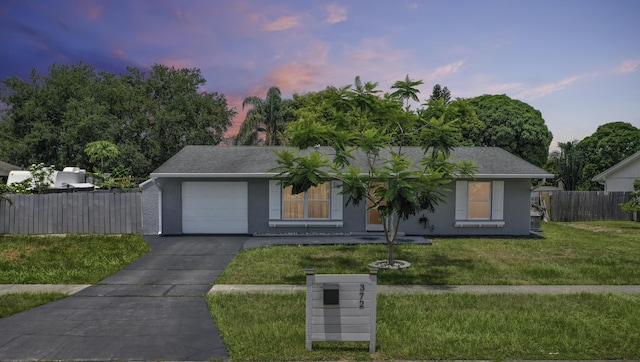 372 NE Ardsley Dr, Port Saint Lucie, FL 34983 - single story home with a garage, concrete driveway, and stucco siding