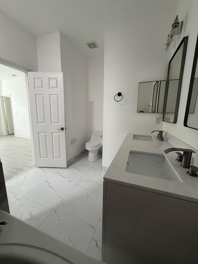 108 W Pigeon Plum Dr W Unit 102, Jupiter, FL 33458 - bathroom featuring marble finish floors and double vanity