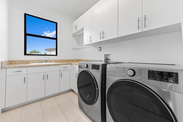 17380 Rainstream Rd, Boca Raton, FL 33496 - washroom featuring independent washer and dryer, cabinet space, and light tile patterned floors