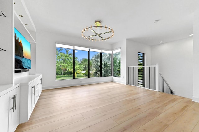 17380 Rainstream Rd, Boca Raton, FL 33496 - unfurnished living room featuring a chandelier, light wood finished floors, and recessed lighting