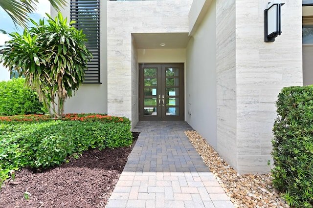 17380 Rainstream Rd, Boca Raton, FL 33496 - view of exterior entry with french doors and brick siding