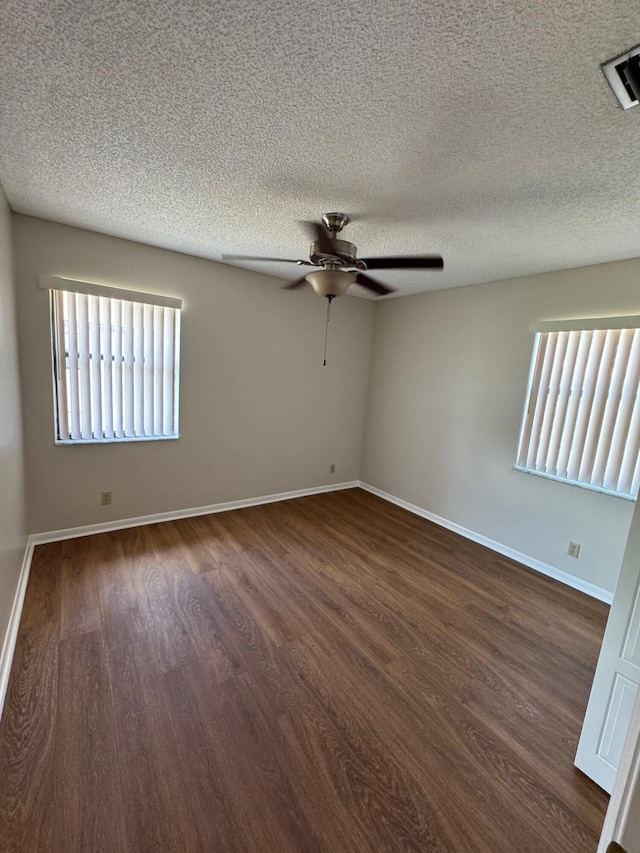7626 Tahiti Ln Unit 204, Lake Worth, FL 33467 - empty room featuring dark wood-type flooring, ceiling fan, and a textured ceiling