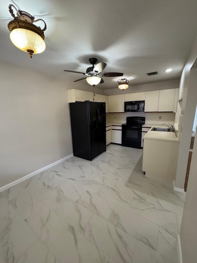 7626 Tahiti Ln Unit 204, Lake Worth, FL 33467 - kitchen featuring black appliances, light marble finish floors, white cabinetry, light countertops, and ceiling fan
