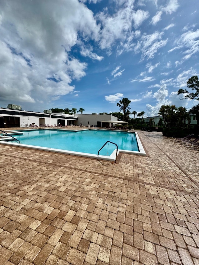 7626 Tahiti Ln Unit 204, Lake Worth, FL 33467 - community pool featuring a patio