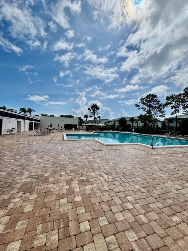7626 Tahiti Ln Unit 204, Lake Worth, FL 33467 - community pool featuring a patio