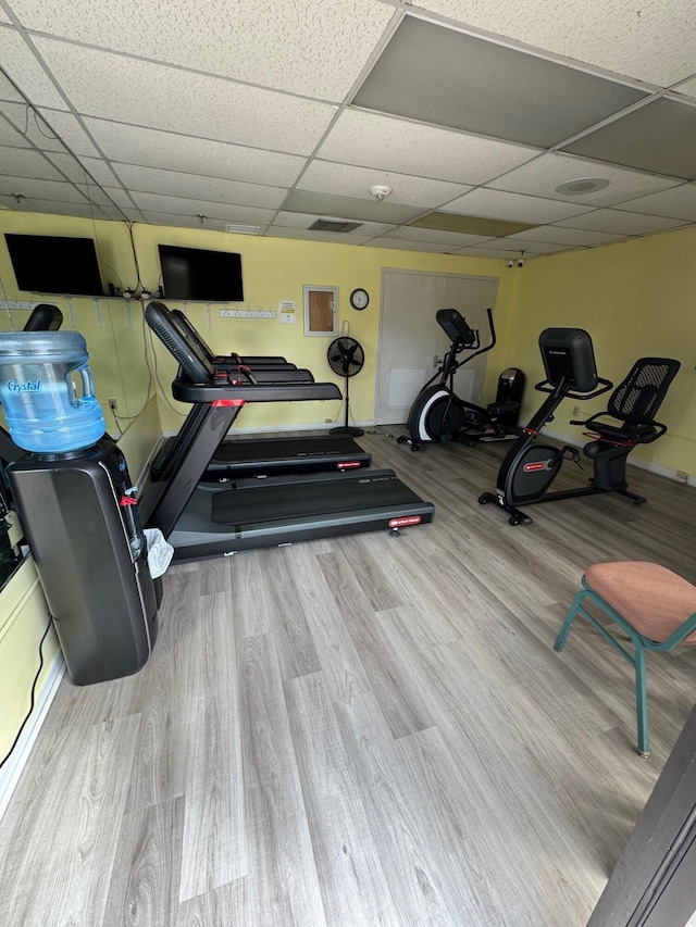 7626 Tahiti Ln Unit 204, Lake Worth, FL 33467 - workout area featuring a drop ceiling and wood finished floors