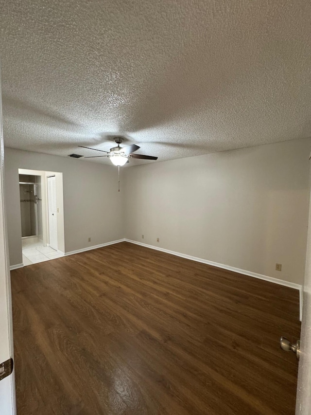 7626 Tahiti Ln Unit 204, Lake Worth, FL 33467 - unfurnished room featuring a ceiling fan, wood finished floors, and a textured ceiling