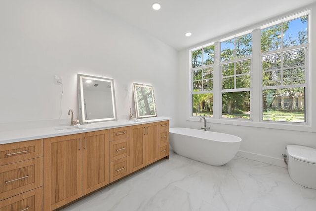 295 Austin Ln, West Palm Beach, FL 33401 - bathroom with marble look tile flooring, a soaking tub, double vanity, and recessed lighting