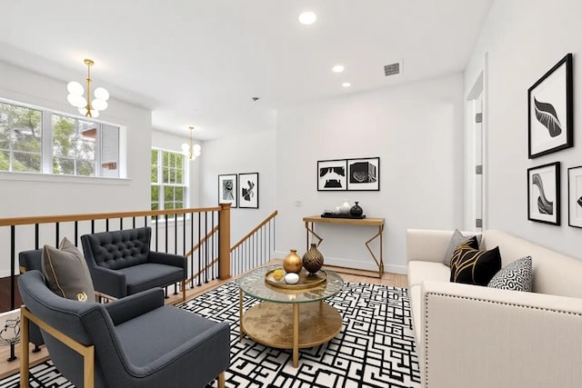295 Austin Ln, West Palm Beach, FL 33401 - living room with a chandelier, wood finished floors, and recessed lighting