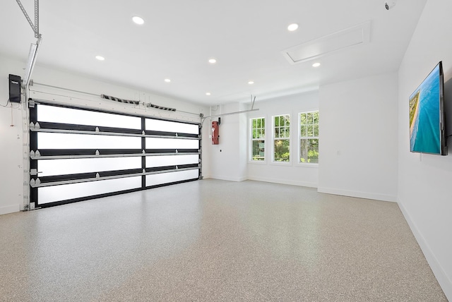 295 Austin Ln, West Palm Beach, FL 33401 - garage featuring recessed lighting and baseboards
