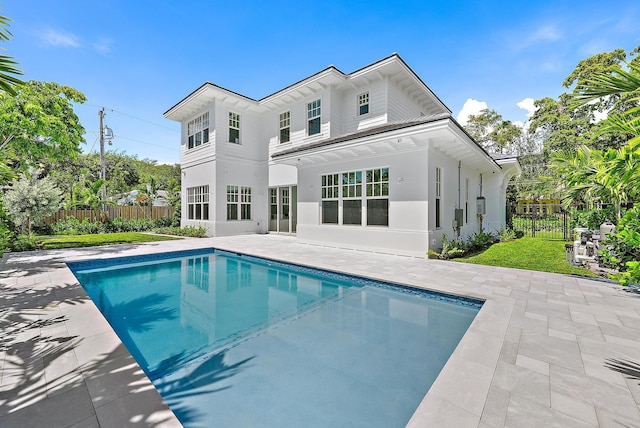 295 Austin Ln, West Palm Beach, FL 33401 - rear view of property featuring a patio area