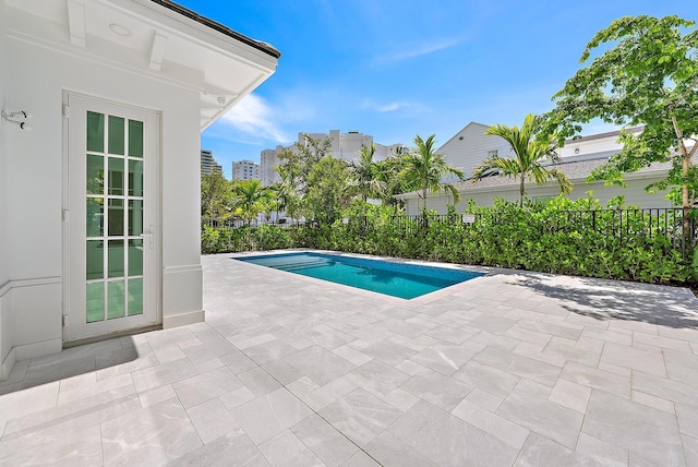 295 Austin Ln, West Palm Beach, FL 33401 - view of swimming pool featuring a patio