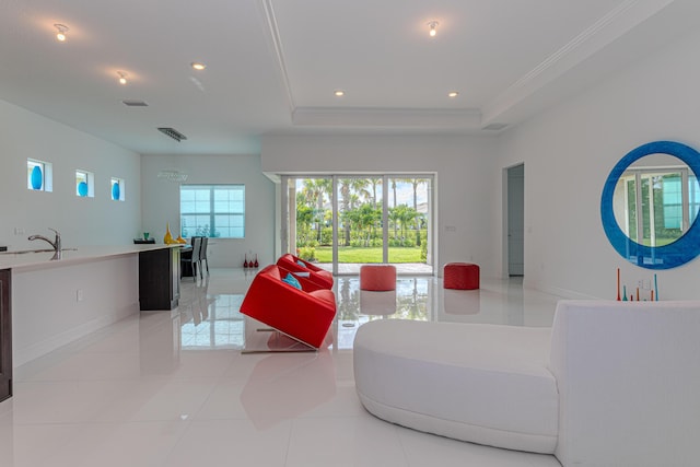 10815 Stellar Cir, Palm Beach Gardens, FL 33412 - living area with recessed lighting, a tray ceiling, crown molding, and light tile patterned floors