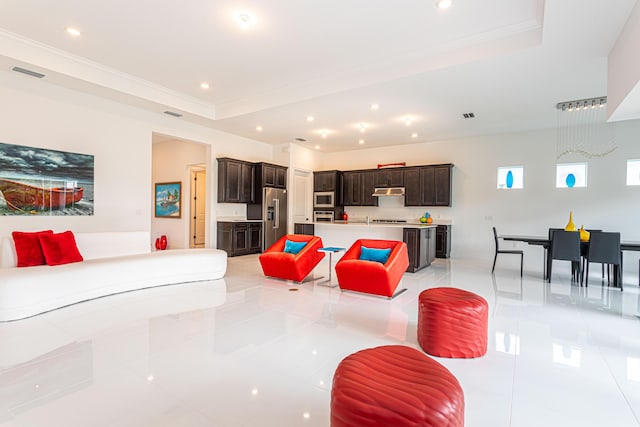 10815 Stellar Cir, Palm Beach Gardens, FL 33412 - living room featuring recessed lighting, a raised ceiling, light tile patterned floors, and ornamental molding