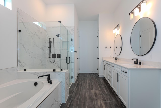 10815 Stellar Cir, Palm Beach Gardens, FL 33412 - full bathroom featuring a garden tub, a marble finish shower, double vanity, and healthy amount of natural light