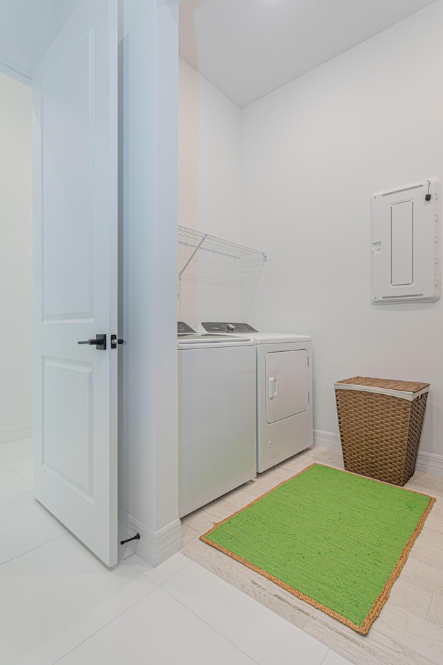 10815 Stellar Cir, Palm Beach Gardens, FL 33412 - laundry room with washer and dryer and electric panel