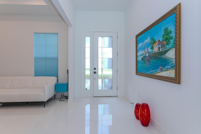10815 Stellar Cir, Palm Beach Gardens, FL 33412 - foyer entrance with tile patterned flooring and baseboards