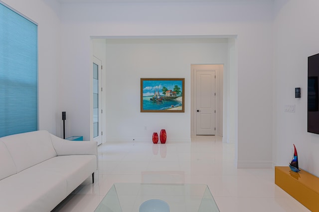 10815 Stellar Cir, Palm Beach Gardens, FL 33412 - living room featuring baseboards and light tile patterned flooring