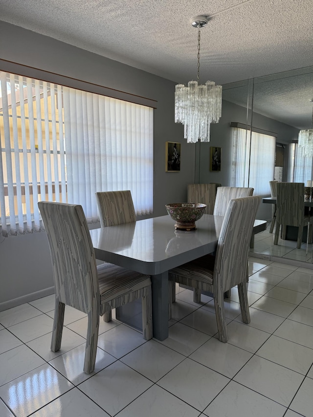 4022 Wolverton B, Boca Raton, FL 33434 - dining room featuring a chandelier, a textured ceiling, and tile patterned flooring