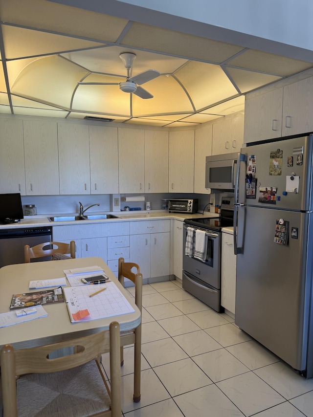 4022 Wolverton B, Boca Raton, FL 33434 - kitchen with appliances with stainless steel finishes, light countertops, light tile patterned flooring, and ceiling fan
