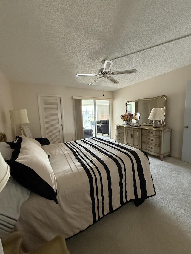 4022 Wolverton B, Boca Raton, FL 33434 - bedroom with light carpet, a ceiling fan, and a textured ceiling