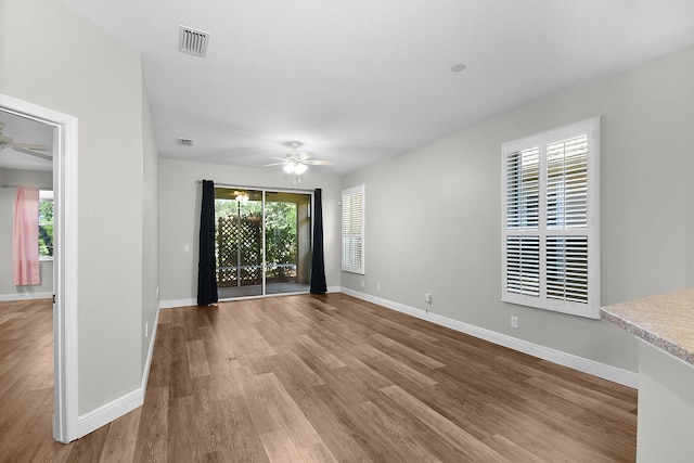 3611 NW Willow Creek Dr, Jensen Beach, FL 34957 - unfurnished room with a ceiling fan, healthy amount of natural light, and wood finished floors
