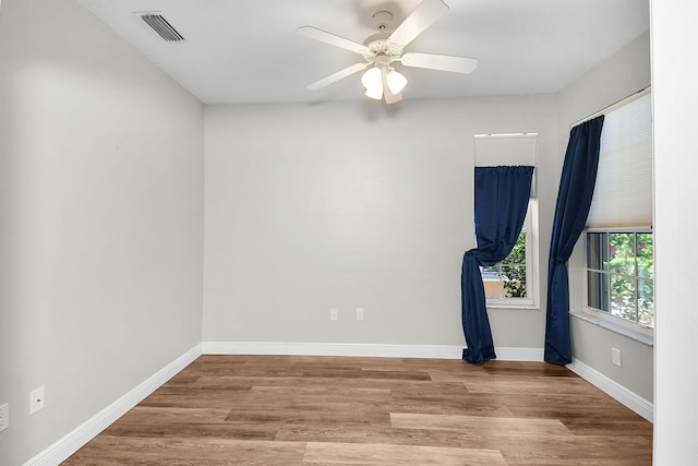 3611 NW Willow Creek Dr, Jensen Beach, FL 34957 - unfurnished room featuring wood finished floors and ceiling fan