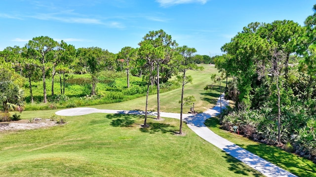 3611 NW Willow Creek Dr, Jensen Beach, FL 34957 - view of home's community with a yard and view of scattered trees