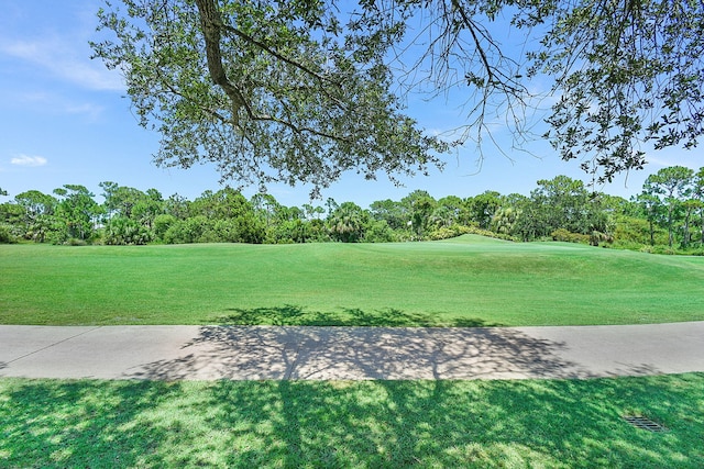 3611 NW Willow Creek Dr, Jensen Beach, FL 34957 - view of community featuring golf course view, a yard, and view of wooded area