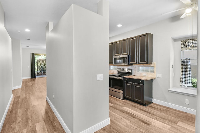 3611 NW Willow Creek Dr, Jensen Beach, FL 34957 - kitchen with appliances with stainless steel finishes, light wood-style floors, ceiling fan, decorative backsplash, and recessed lighting
