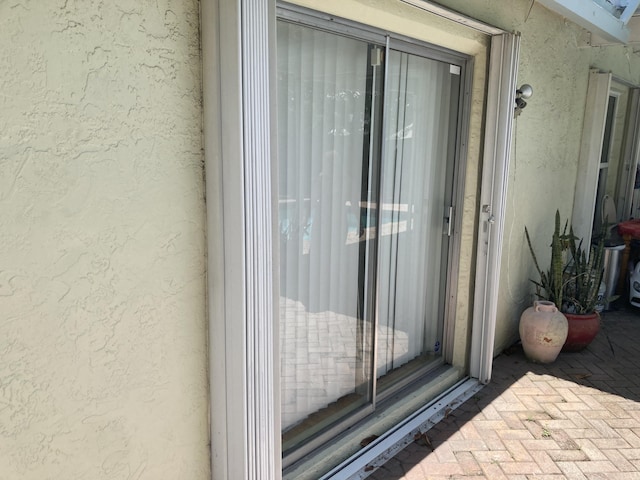 9165 SW 18th St, Boca Raton, FL 33428 - view of exterior entry featuring stucco siding