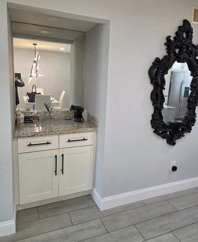 21404 Cypress Hammock Dr Unit 45E, Boca Raton, FL 33428 - bar area with wood tiled floors and baseboards