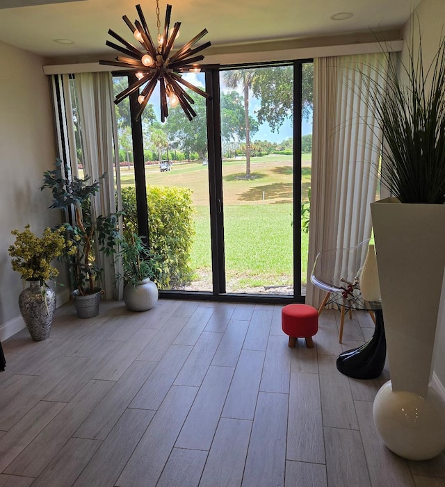 21404 Cypress Hammock Dr Unit 45E, Boca Raton, FL 33428 - doorway featuring wood finished floors and a chandelier