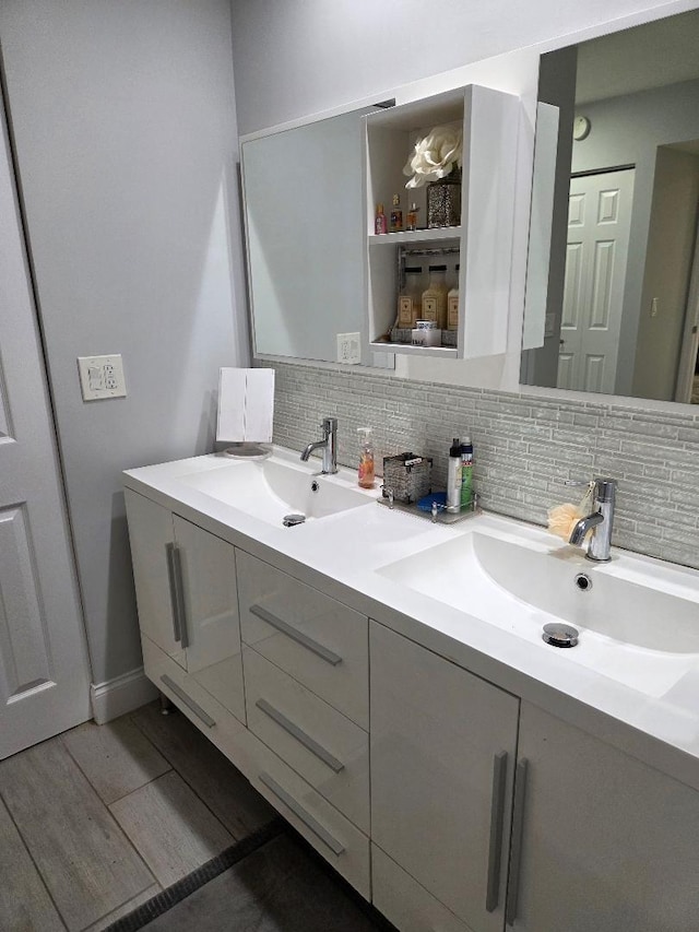 21404 Cypress Hammock Dr Unit 45E, Boca Raton, FL 33428 - full bathroom with double vanity, tasteful backsplash, and wood finished floors