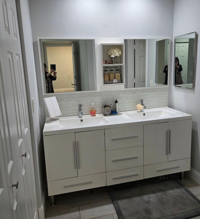 21404 Cypress Hammock Dr Unit 45E, Boca Raton, FL 33428 - bathroom with double vanity and decorative backsplash