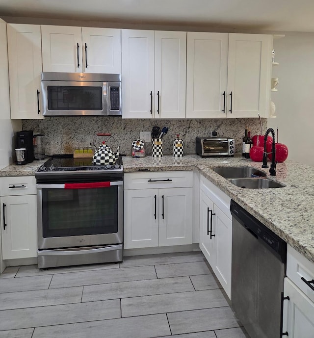 21404 Cypress Hammock Dr Unit 45E, Boca Raton, FL 33428 - kitchen with appliances with stainless steel finishes and white cabinets