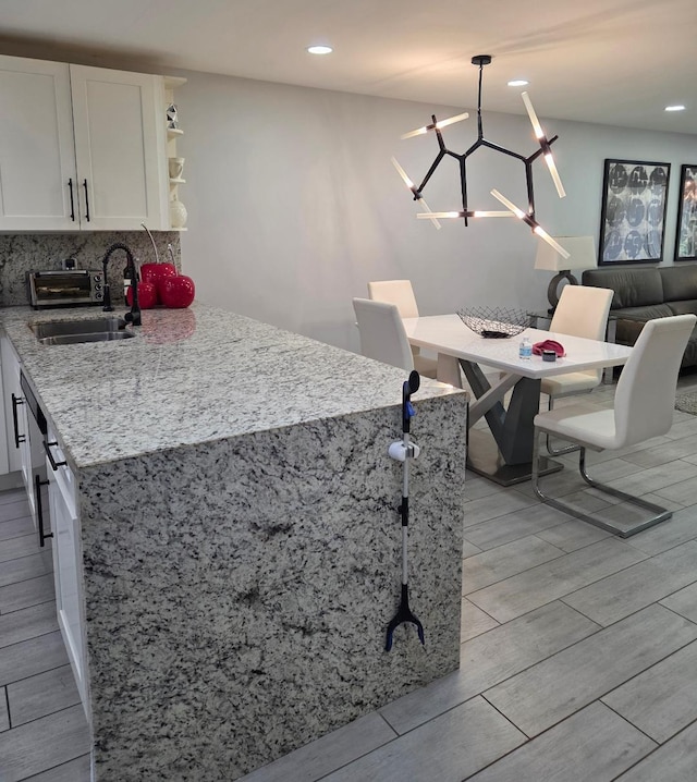 21404 Cypress Hammock Dr Unit 45E, Boca Raton, FL 33428 - kitchen featuring wood finish floors, white cabinetry, open shelves, light stone countertops, and recessed lighting