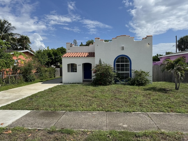 639 38th St, West Palm Beach, FL 33407 - mediterranean / spanish-style house with stucco siding and a tile roof